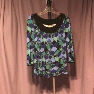 Purple, green beautiful tones in this top.